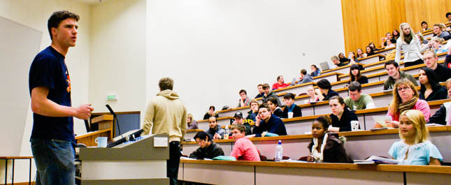 Riches speaking during a lecture.