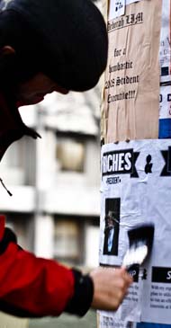 Rainbow putting up election posters.